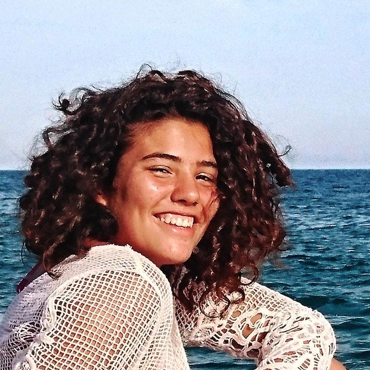 Kaveri Mehta, Lead Design Curator at CoreDuneRoot, reviewing corporate floral arrangements